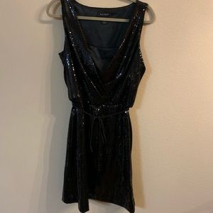 Size 10 black sequin dress with tie waist detail.